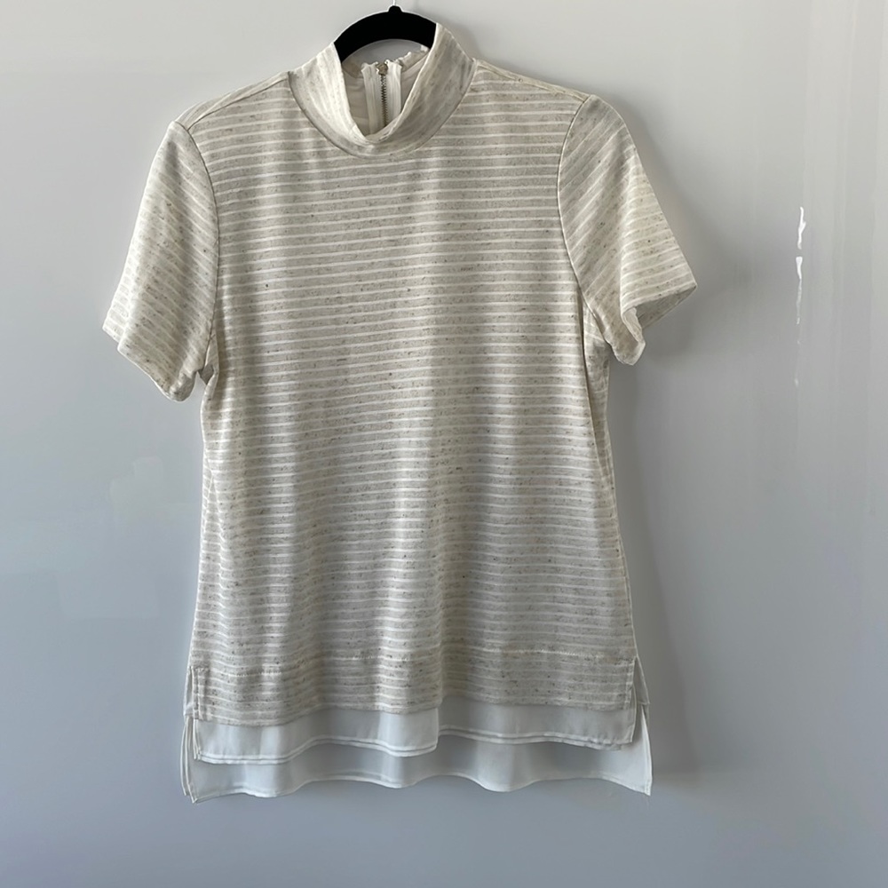 Women’s short sleeve mock turtleneck shirt.